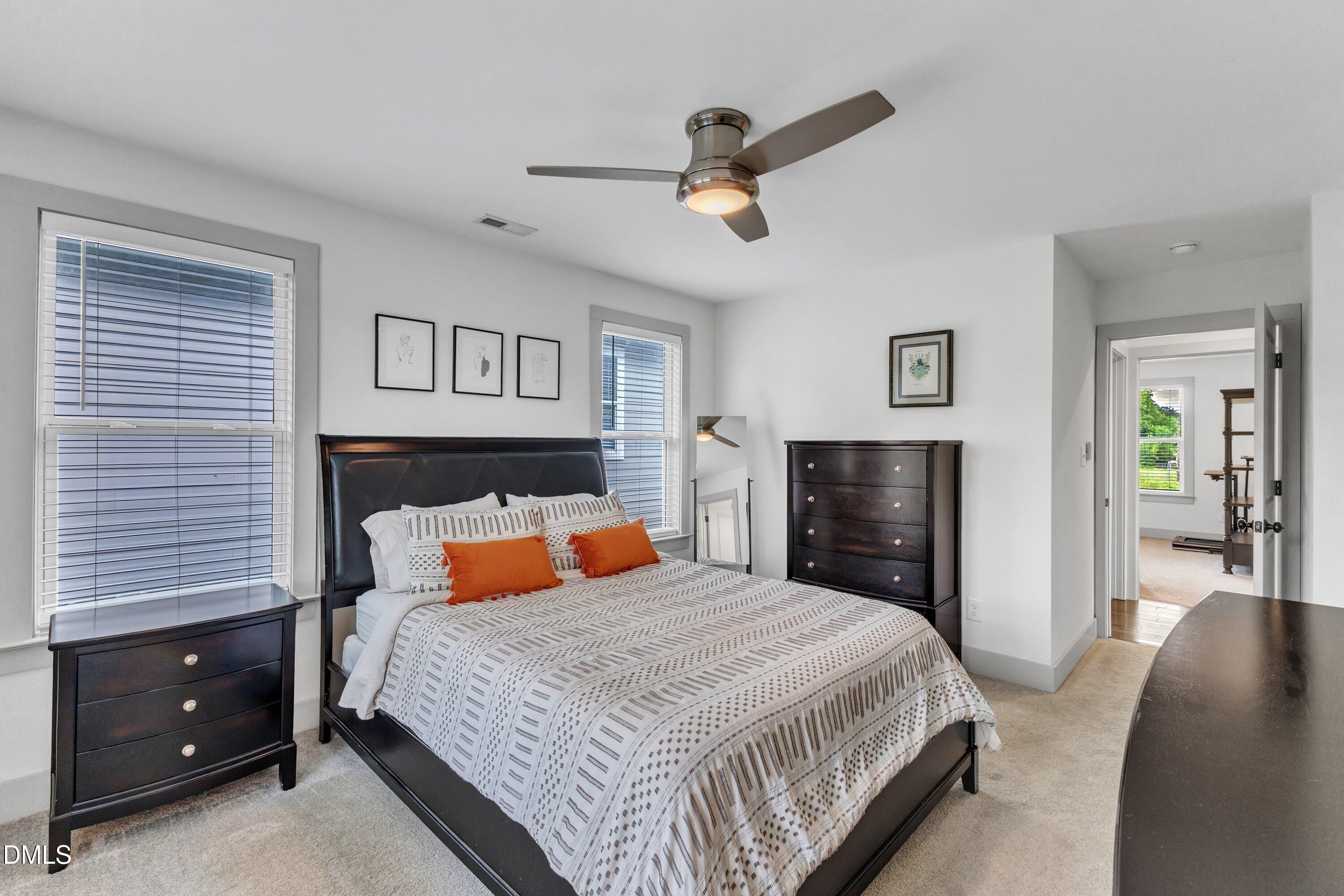 3 Maple Street Raleigh, NC 27610 - Photo 29 of 39 a bedroom with a bed and ceiling fan