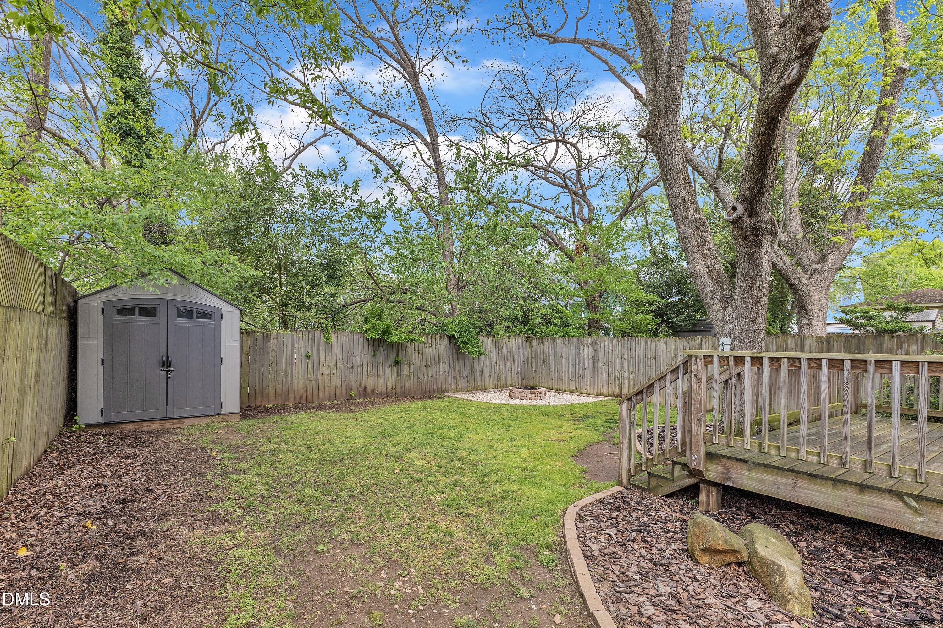 3 Maple Street Raleigh, NC 27610 - Photo 33 of 39 a view of a backyard with a small cabin and a chair