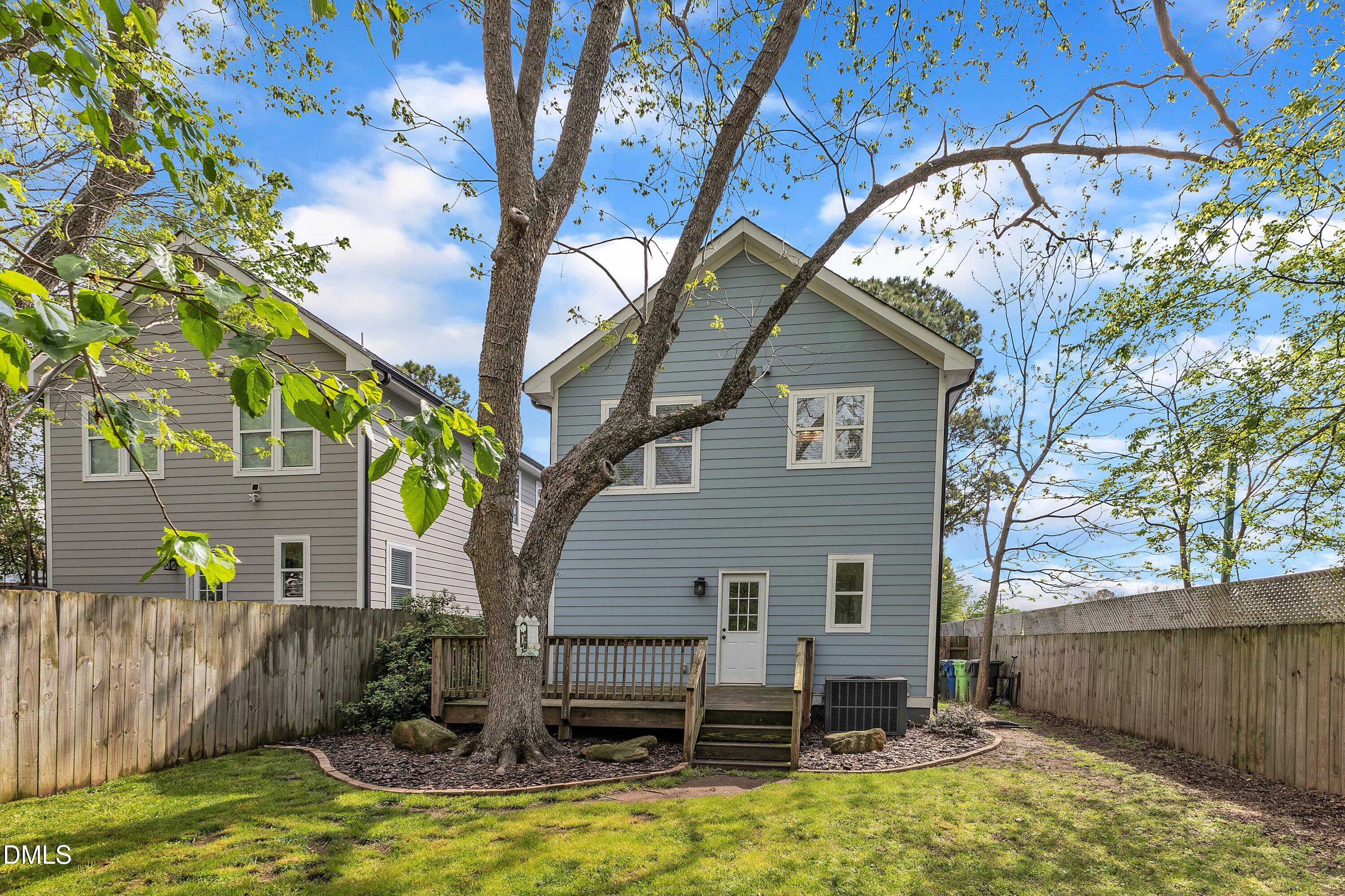 3 Maple Street Raleigh, NC 27610 - Photo 37 of 39 a backyard of a house with table and chairs