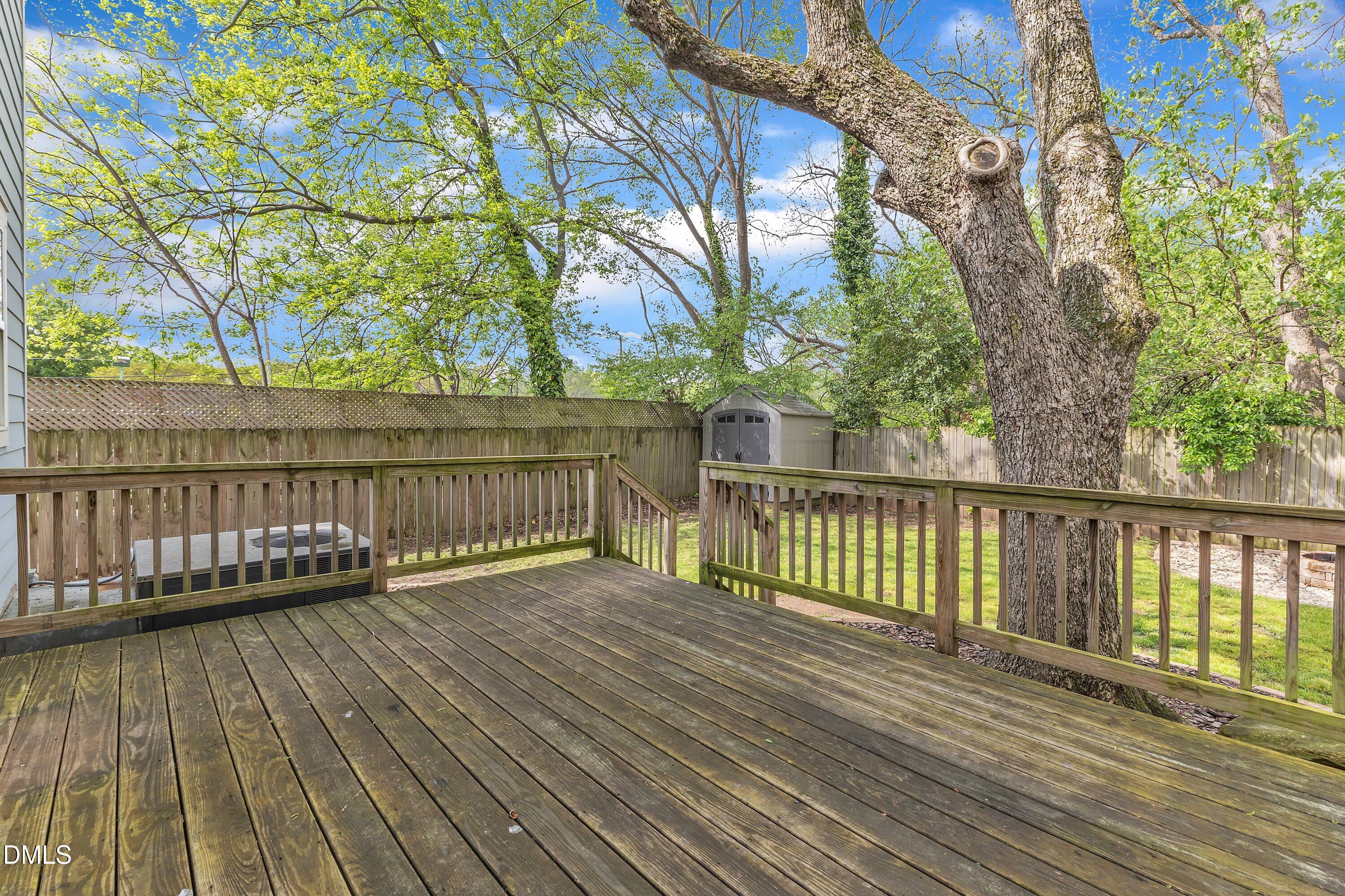 3 Maple Street Raleigh, NC 27610 - Photo 38 of 39 a view of deck with wooden floor and fence with a pot