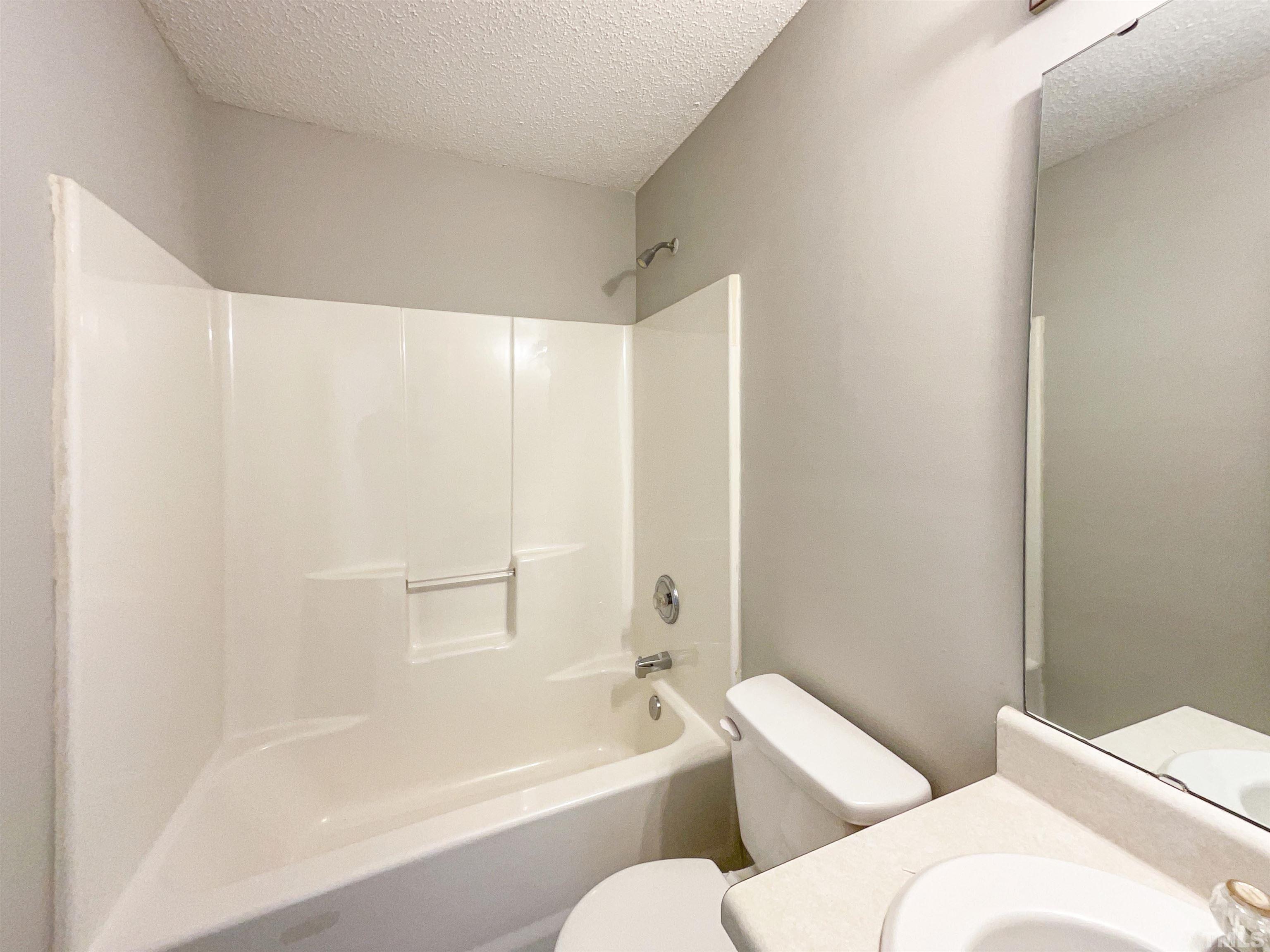 3300 Marcony Way Raleigh, NC 27610 - Photo 11 of 15 a bathroom with a bathtub and toilet