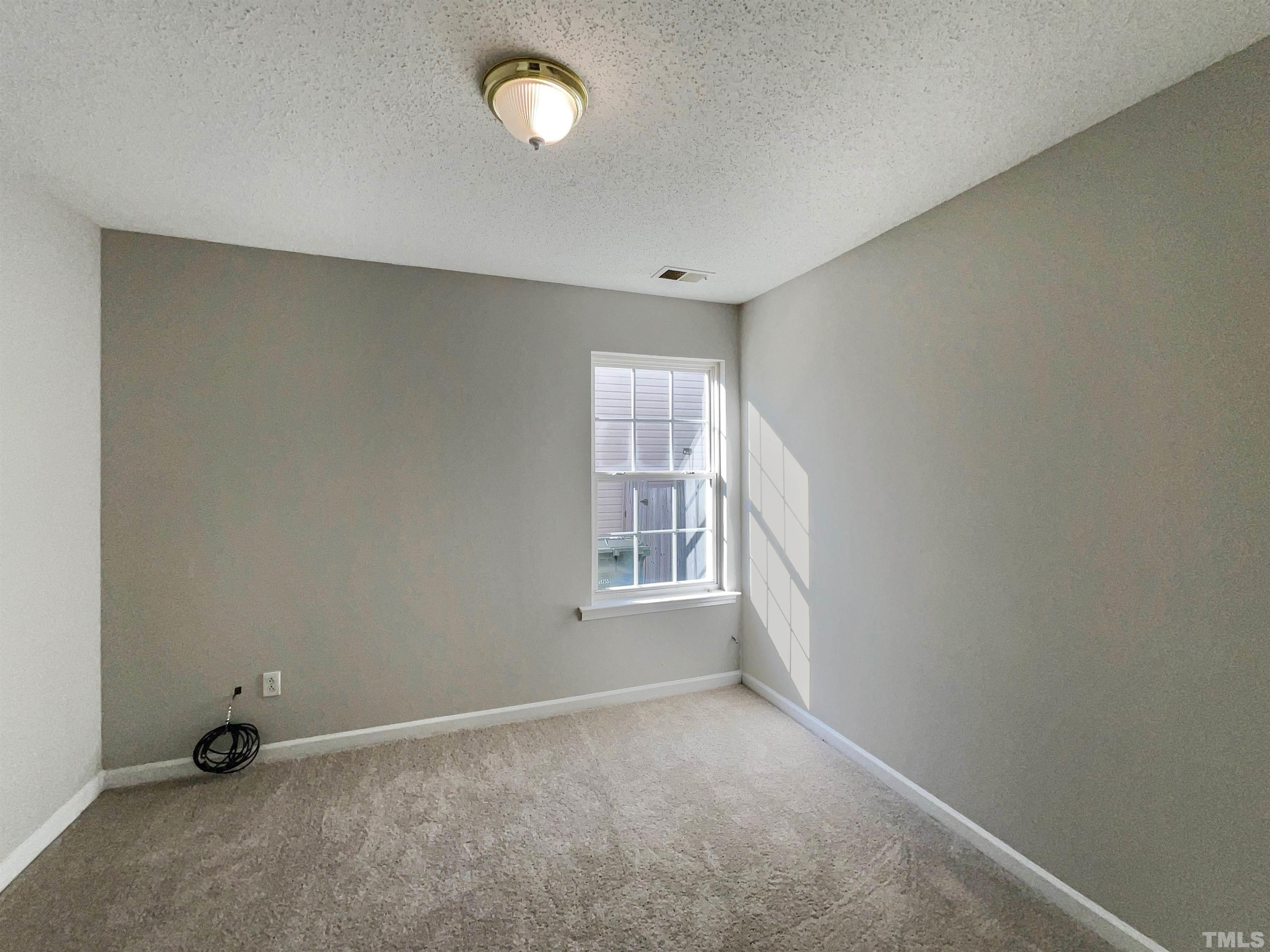 3300 Marcony Way Raleigh, NC 27610 - Photo 12 of 15 an empty room with windows