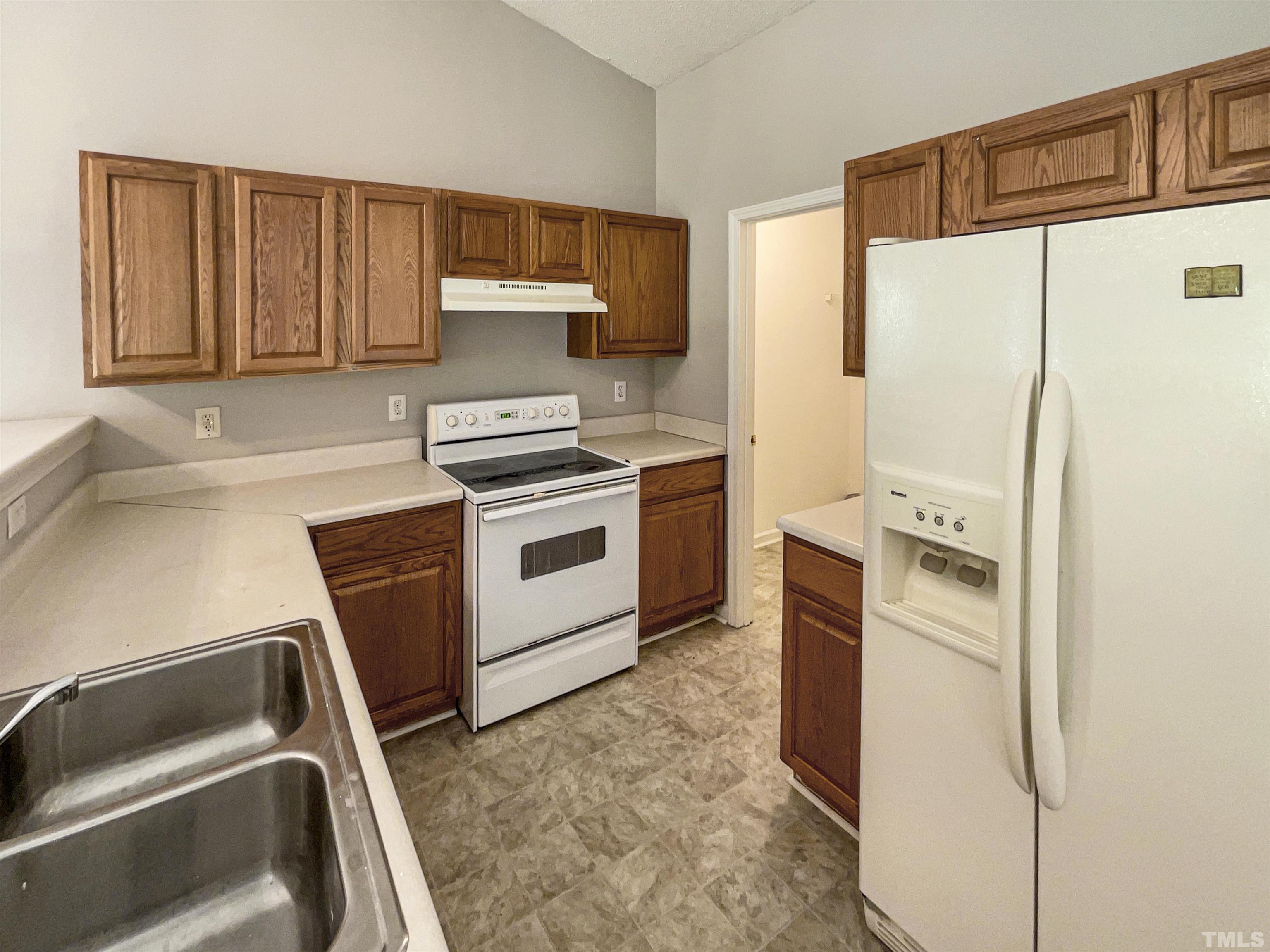 3300 Marcony Way Raleigh, NC 27610 - Photo 2 of 15 a kitchen with a refrigerator sink and stove