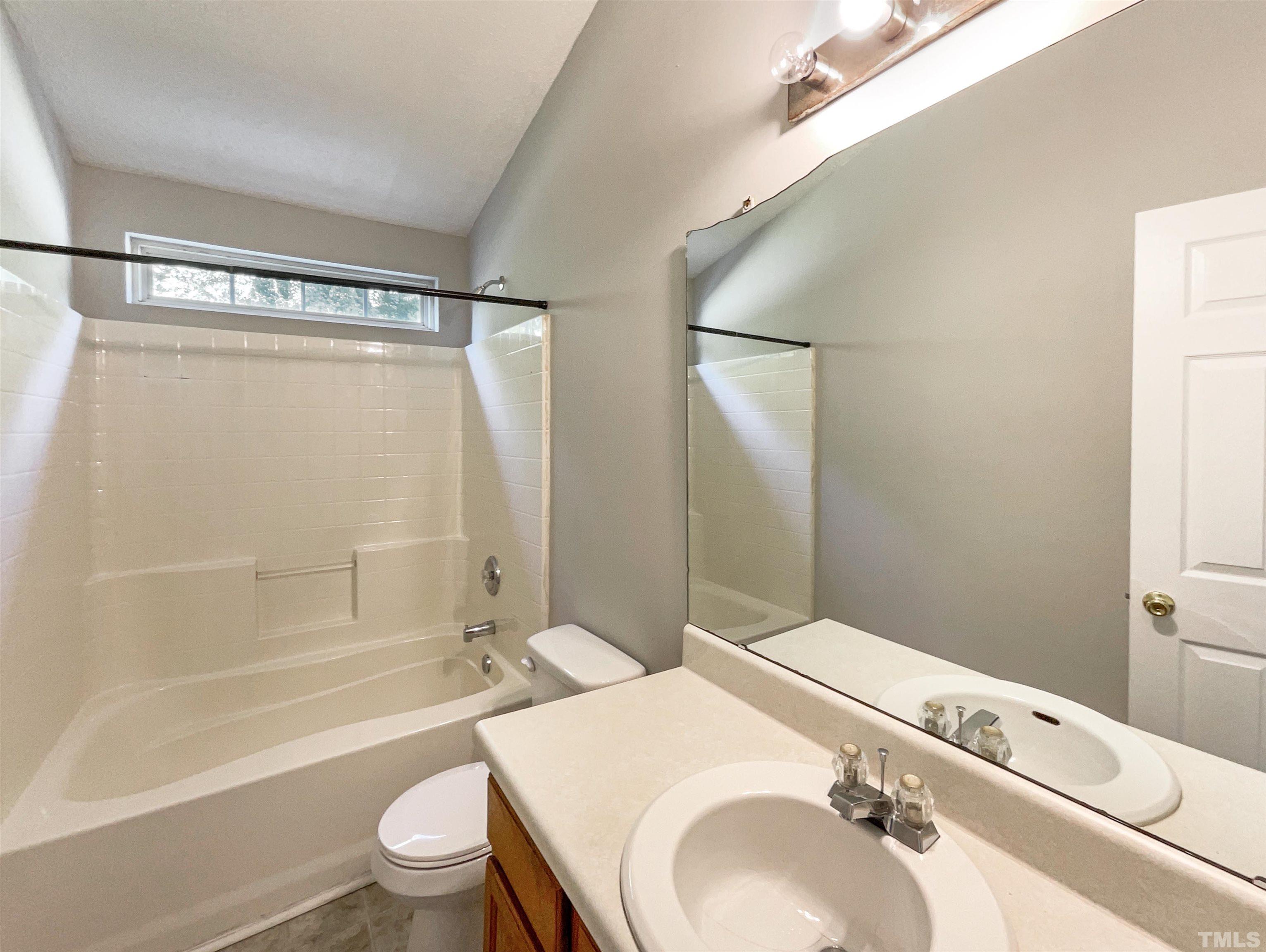 3300 Marcony Way Raleigh, NC 27610 - Photo 4 of 15 a bathroom with a sink toilet and shower