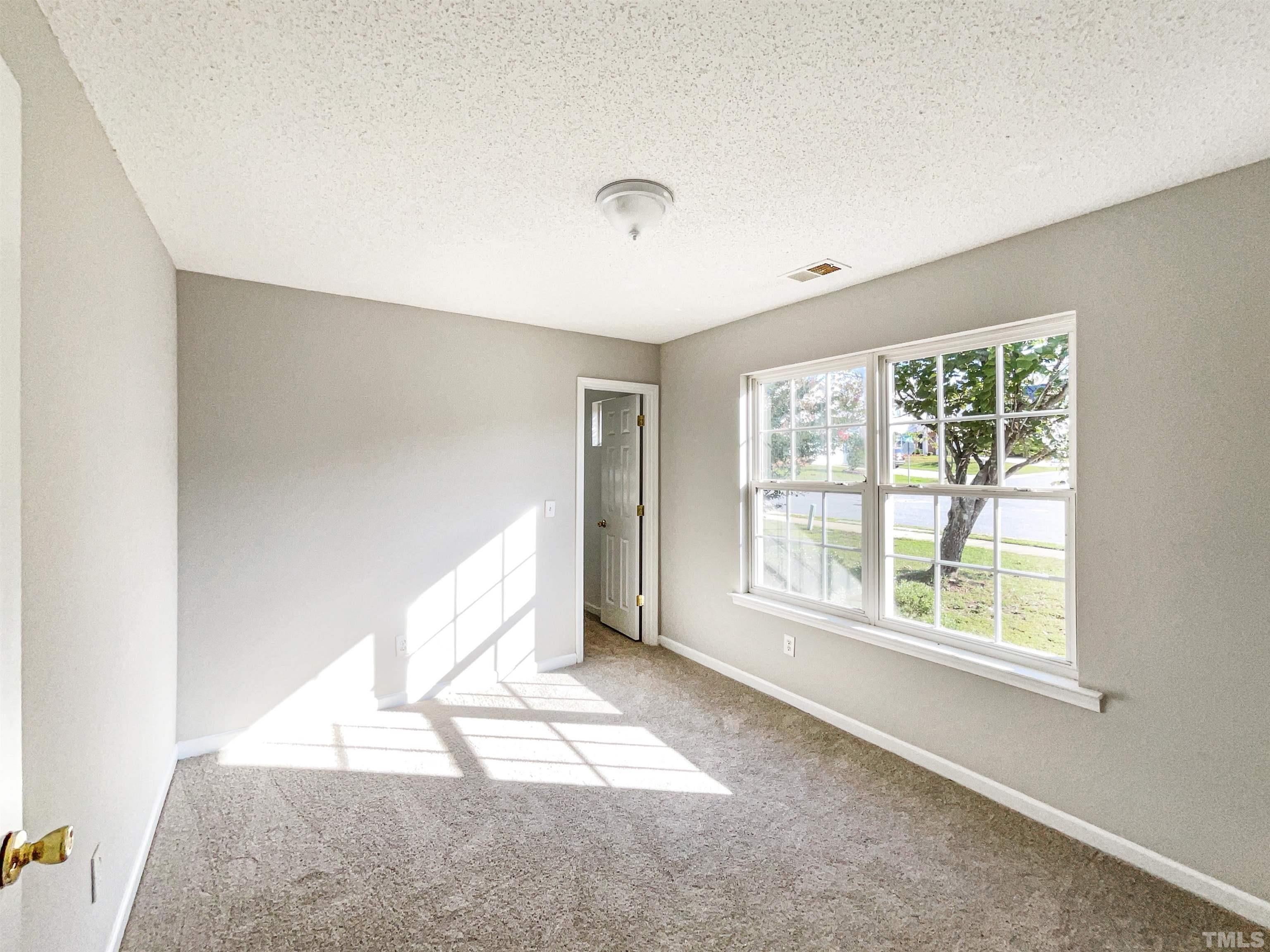3300 Marcony Way Raleigh, NC 27610 - Photo 7 of 15 a view of an empty room with a window