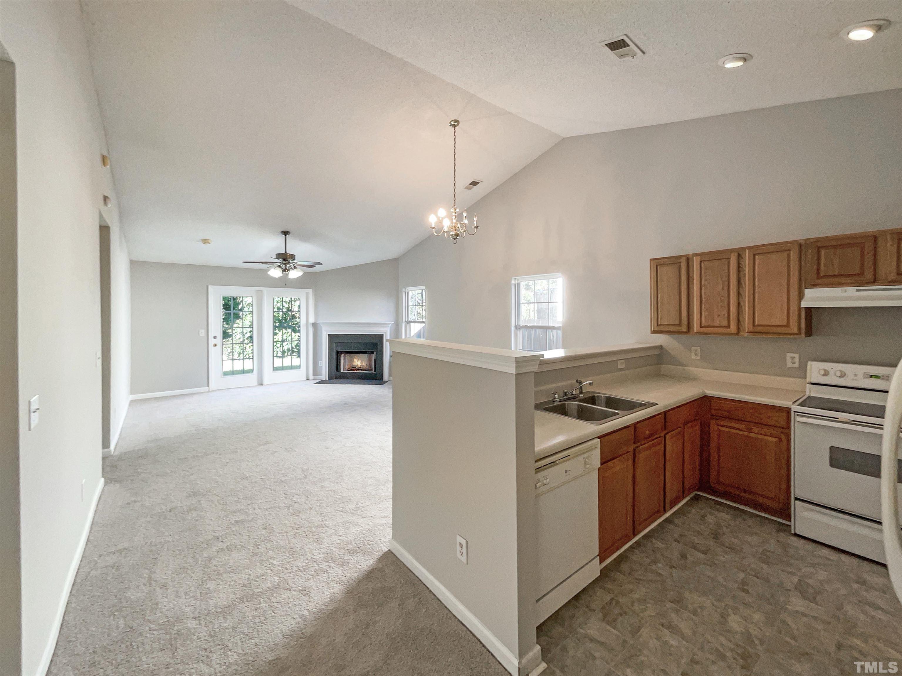 3300 Marcony Way Raleigh, NC 27610 - Photo 8 of 15 a kitchen with stainless steel appliances granite countertop a stove top oven a sink a counter top space and cabinets