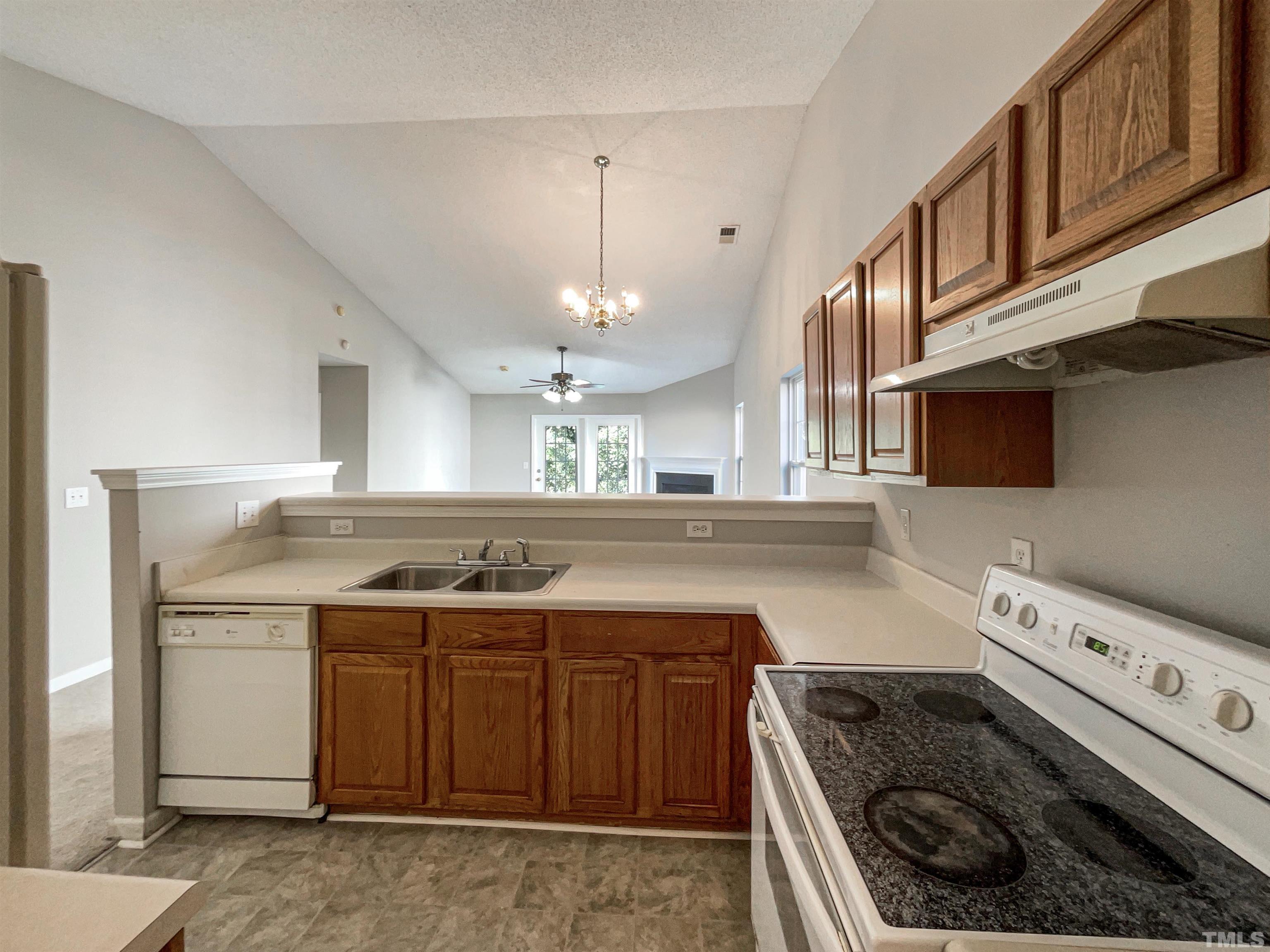 3300 Marcony Way Raleigh, NC 27610 - Photo 9 of 15 a kitchen with a stove and a sink