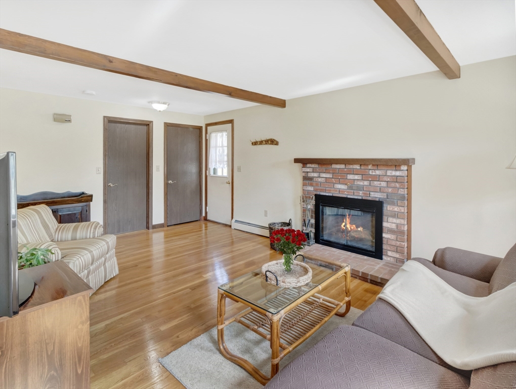 15 Riverside Drive Mansfield, MA 02048 - Photo 4 of 42 a living room with furniture and a fireplace