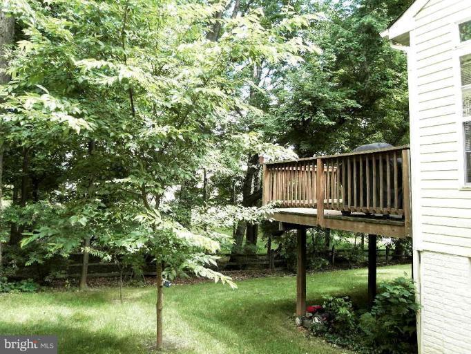 13339 Copper Ridge Road Germantown, MD 20874 - Photo 18 of 20 a view of a backyard with sitting area and garden