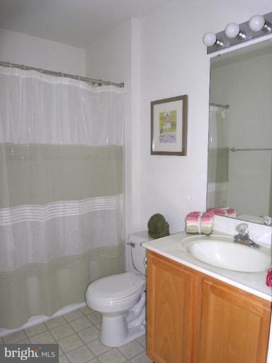 13339 Copper Ridge Road Germantown, MD 20874 - Photo 5 of 20 a bathroom with a sink a toilet and a shower