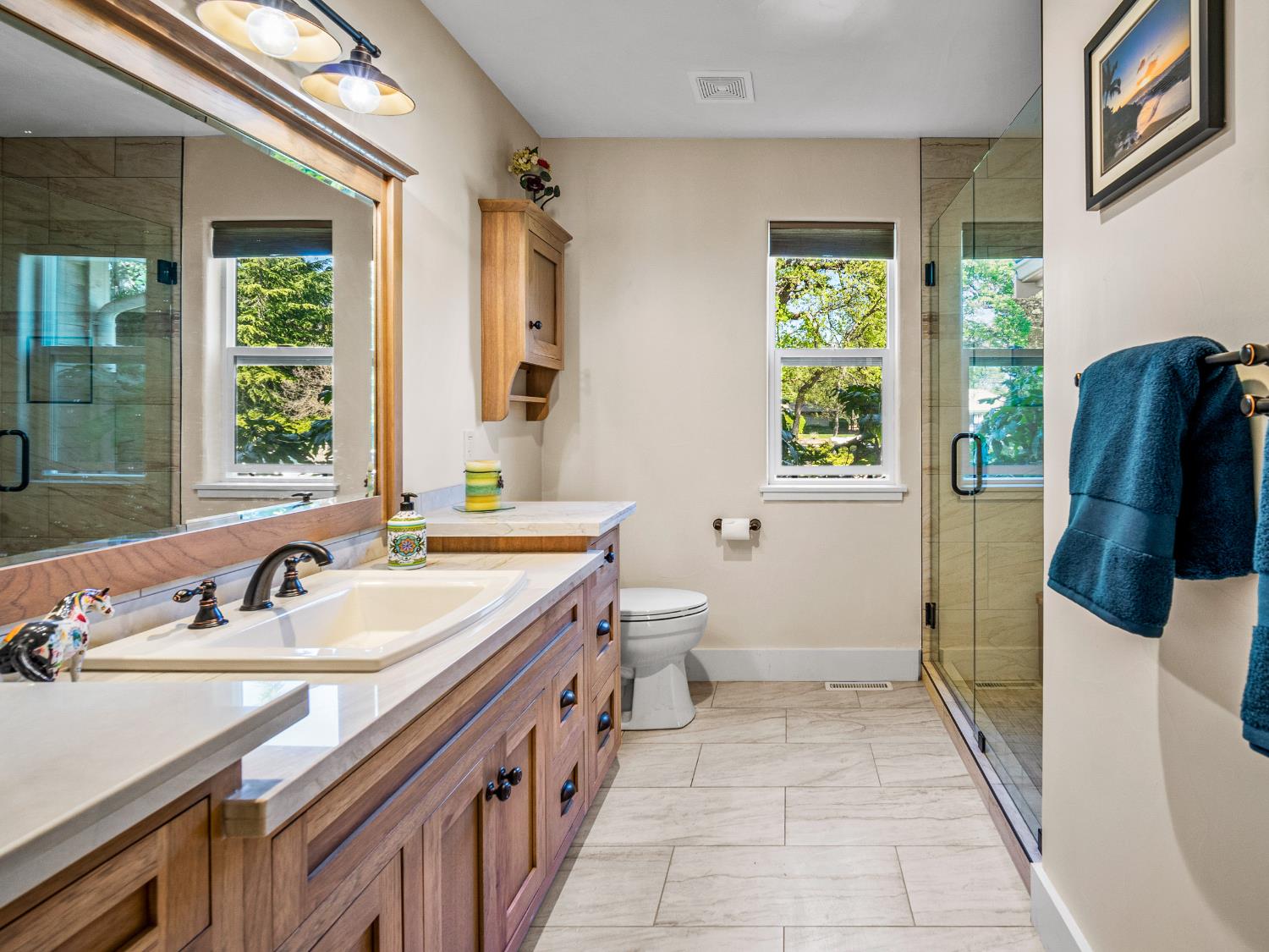 4032 Vega Loop Shingle Springs, CA 95682 - Photo 27 of 44 a bathroom with a double vanity sink a mirror and a bathtub