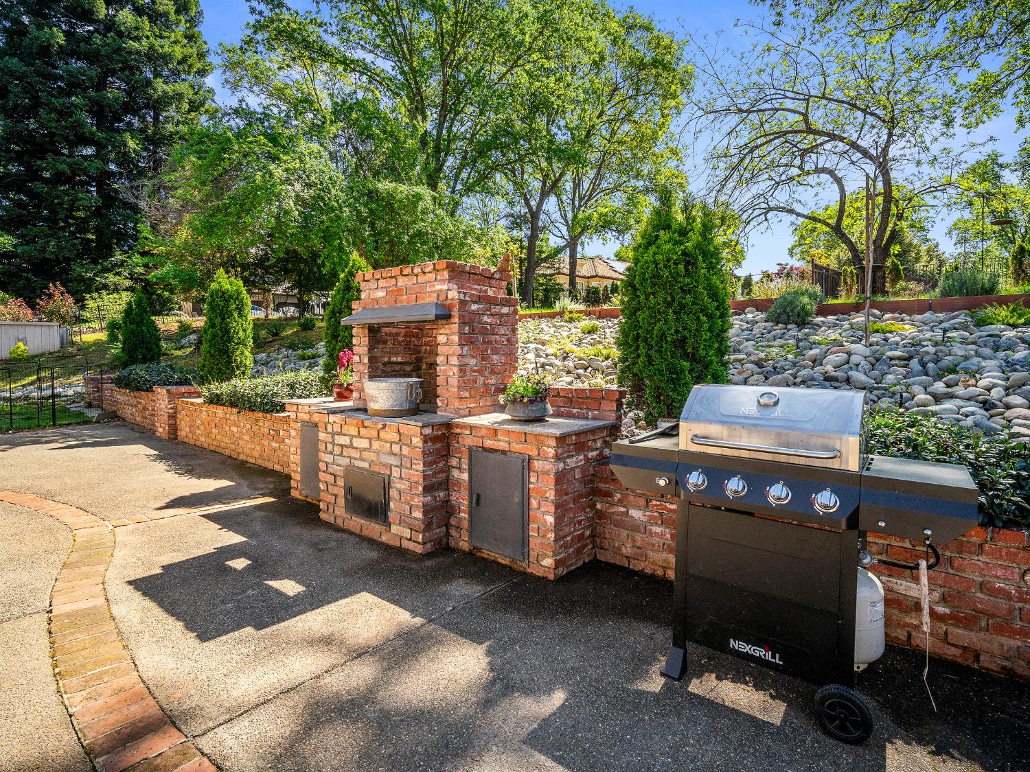 4032 Vega Loop Shingle Springs, CA 95682 - Photo 30 of 44 a view of a chairs and tables in the back yard of the house