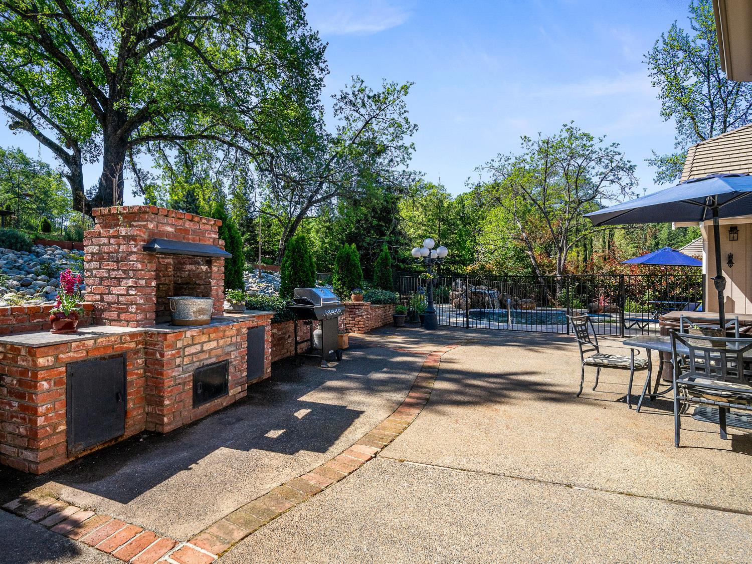 4032 Vega Loop Shingle Springs, CA 95682 - Photo 31 of 44 a view of a patio with chairs and plants