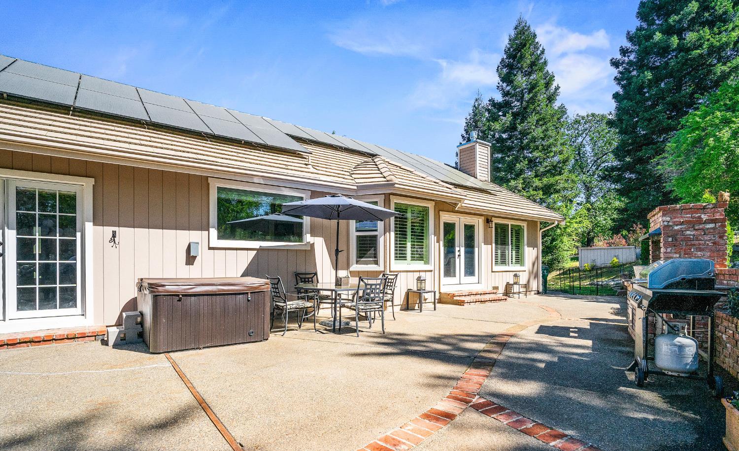 4032 Vega Loop Shingle Springs, CA 95682 - Photo 32 of 44 a building outdoor space with patio furniture and potted plants