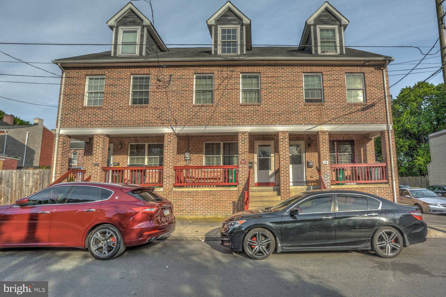 417 Green Street Lancaster, PA 17602 - Photo 1 of 37 a front view of a house with parking space