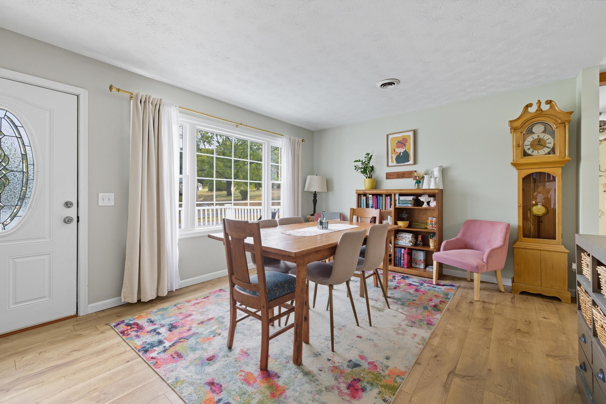 8449 Indian Trail Road Harrisonburg, VA 22802 - Photo 17 of 75 a view of a dining room with furniture window and wooden floor