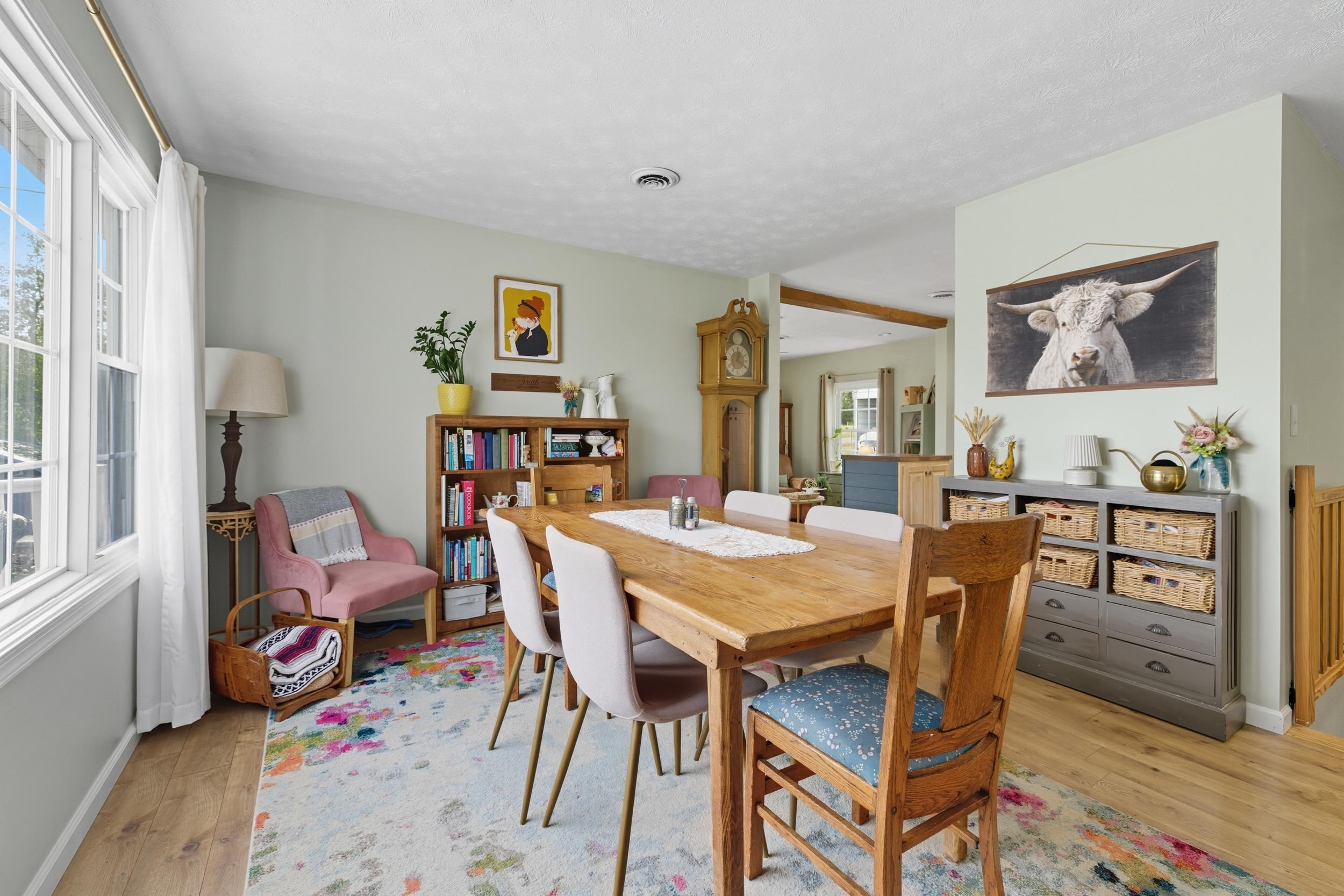 8449 Indian Trail Road Harrisonburg, VA 22802 - Photo 19 of 75 a view of a dining room with furniture and wooden floor