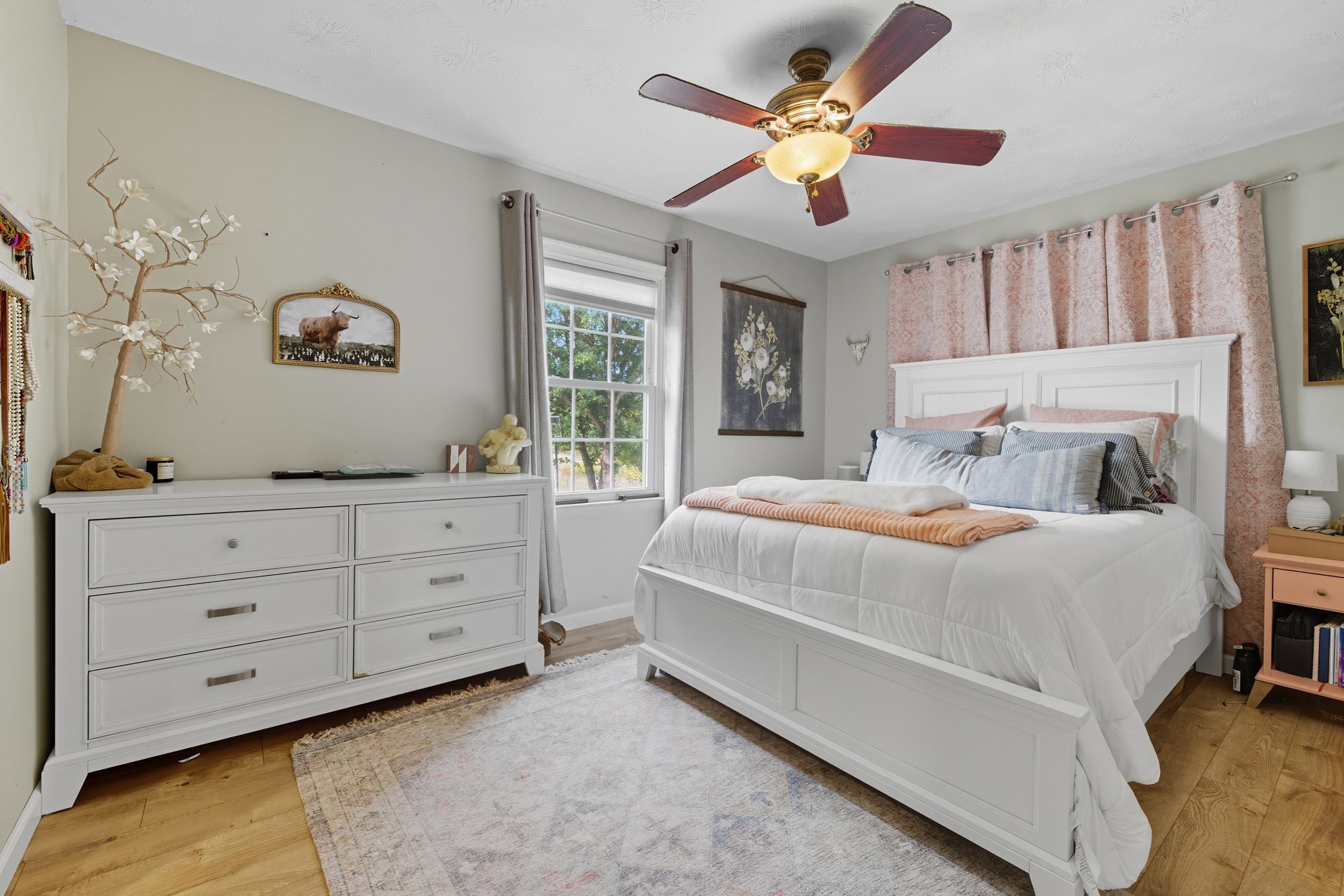 8449 Indian Trail Road Harrisonburg, VA 22802 - Photo 27 of 75 a bedroom with a large bed and a window