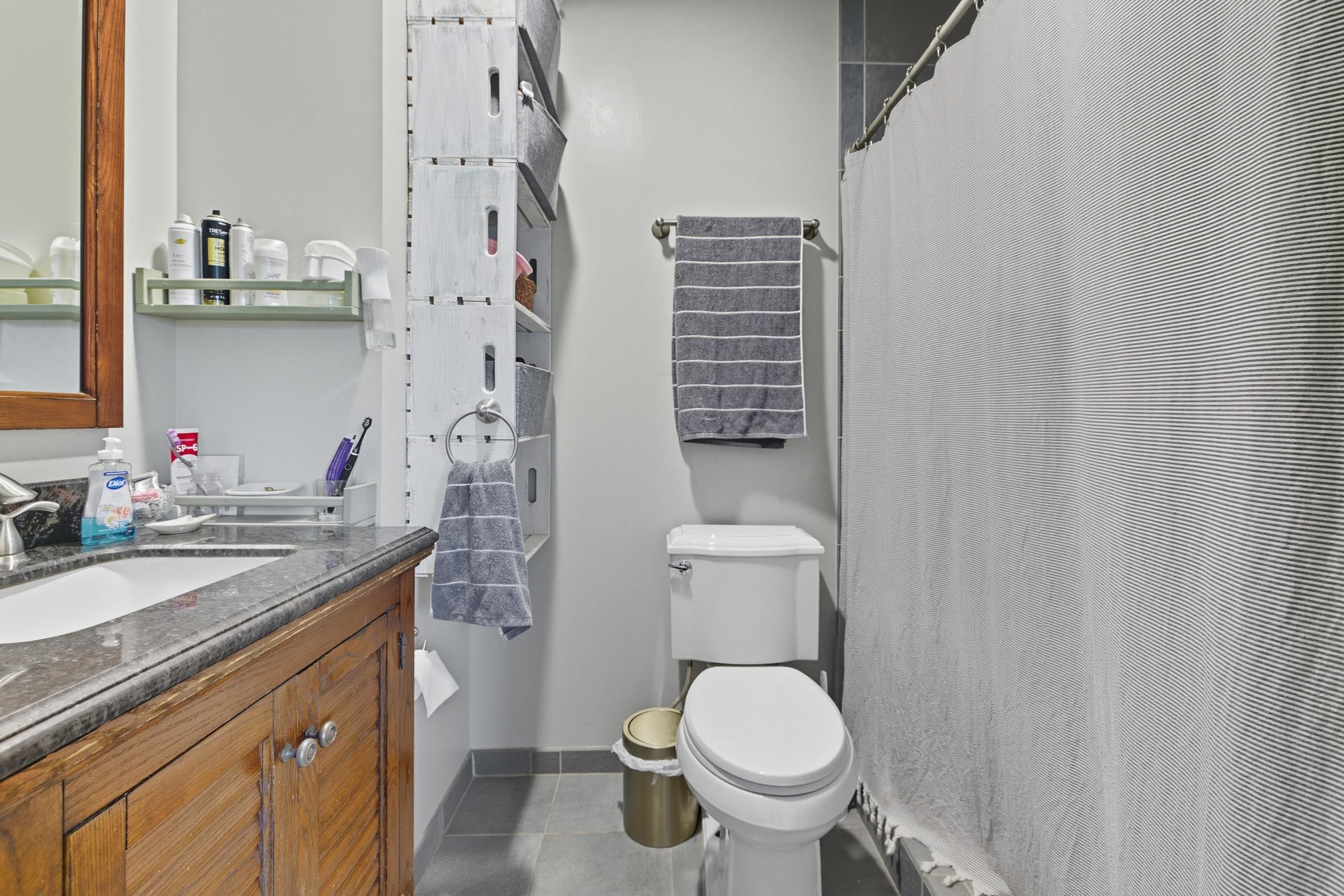 8449 Indian Trail Road Harrisonburg, VA 22802 - Photo 29 of 75 a bathroom with a granite countertop sink toilet and shower
