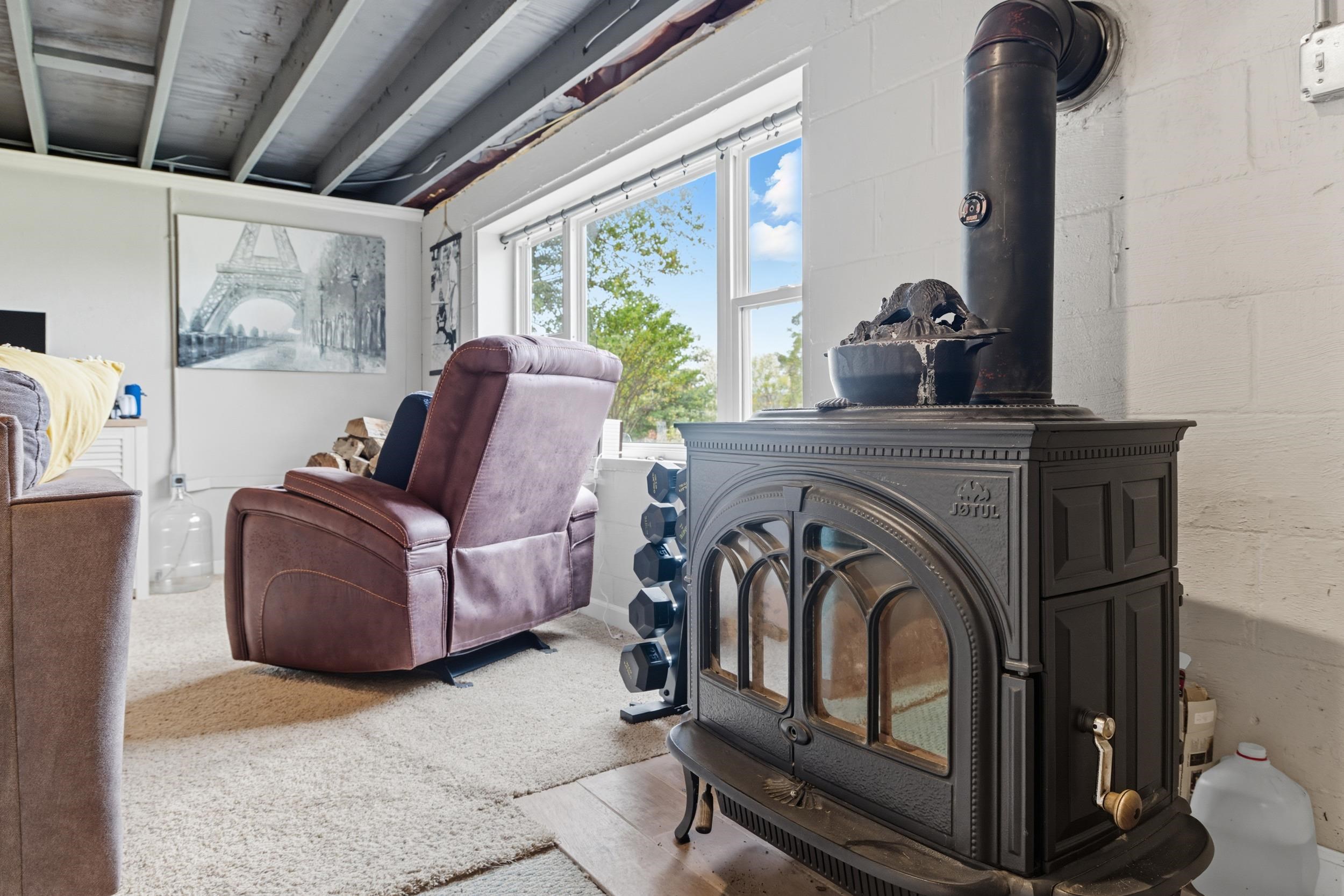 8449 Indian Trail Road Harrisonburg, VA 22802 - Photo 40 of 75 a living room with furniture and a fireplace