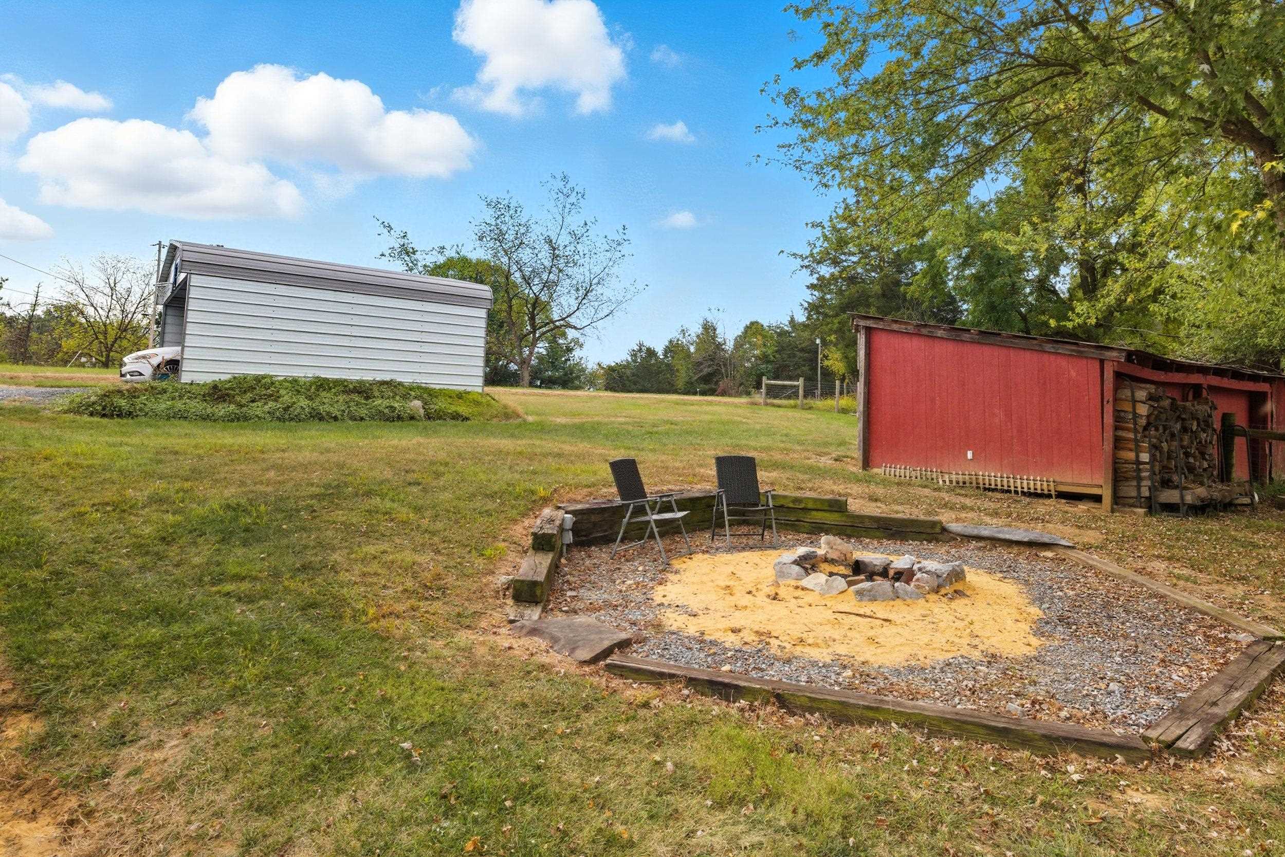 8449 Indian Trail Road Harrisonburg, VA 22802 - Photo 59 of 75 a view of a swimming pool with a table and chairs