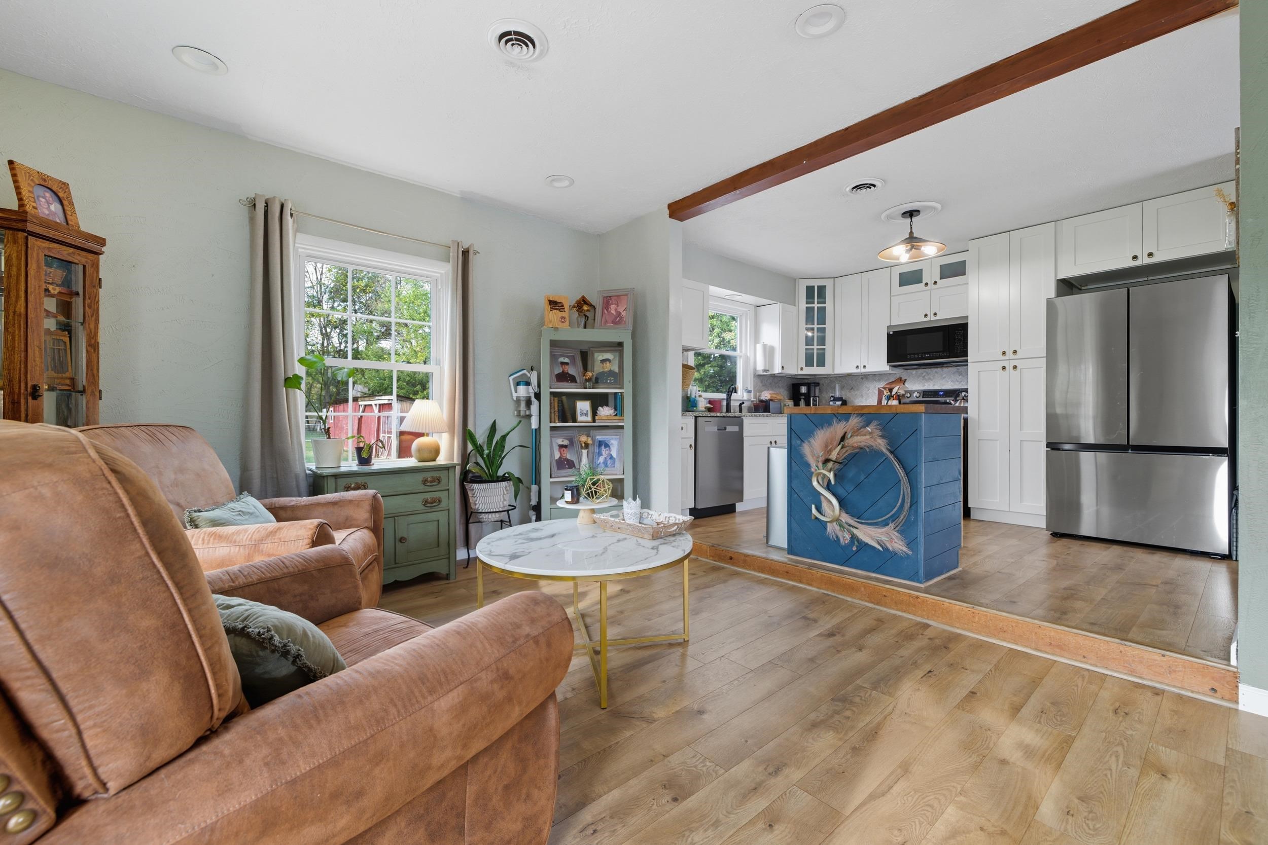 8449 Indian Trail Road Harrisonburg, VA 22802 - Photo 9 of 75 a living room with furniture and a refrigerator