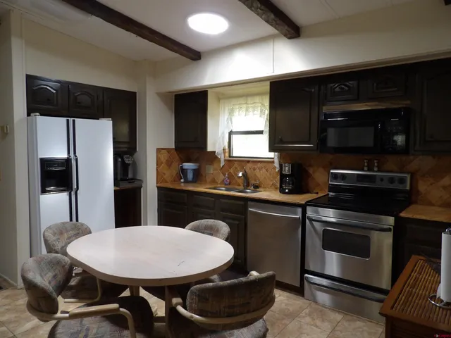 a kitchen with a stove and a microwave