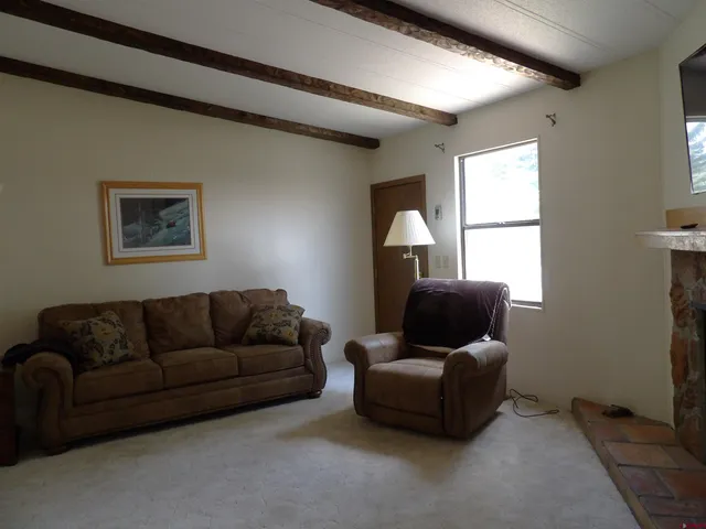 a living room with furniture and a window