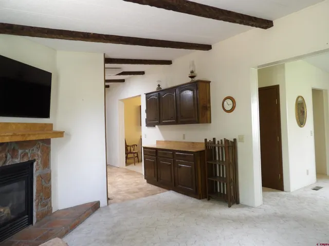 a view of a livingroom with furniture and a flat screen tv