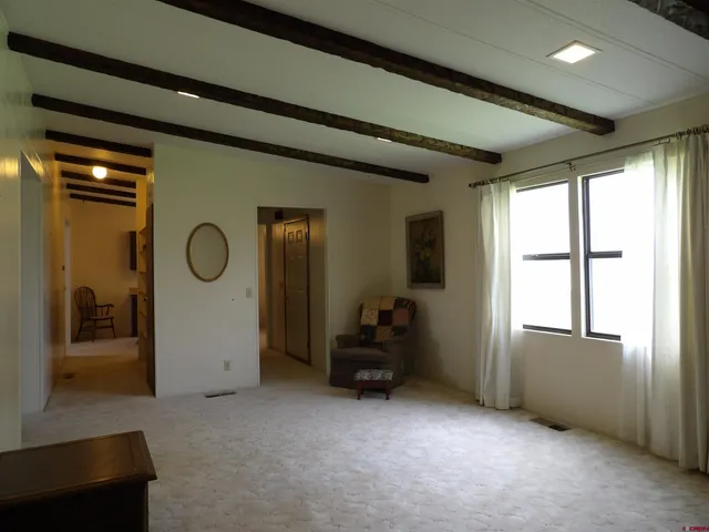 a view of room with workspace and windows