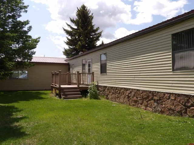 a view of a back yard of the house