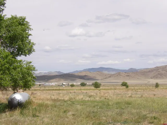 a view of an ocean and a mountain