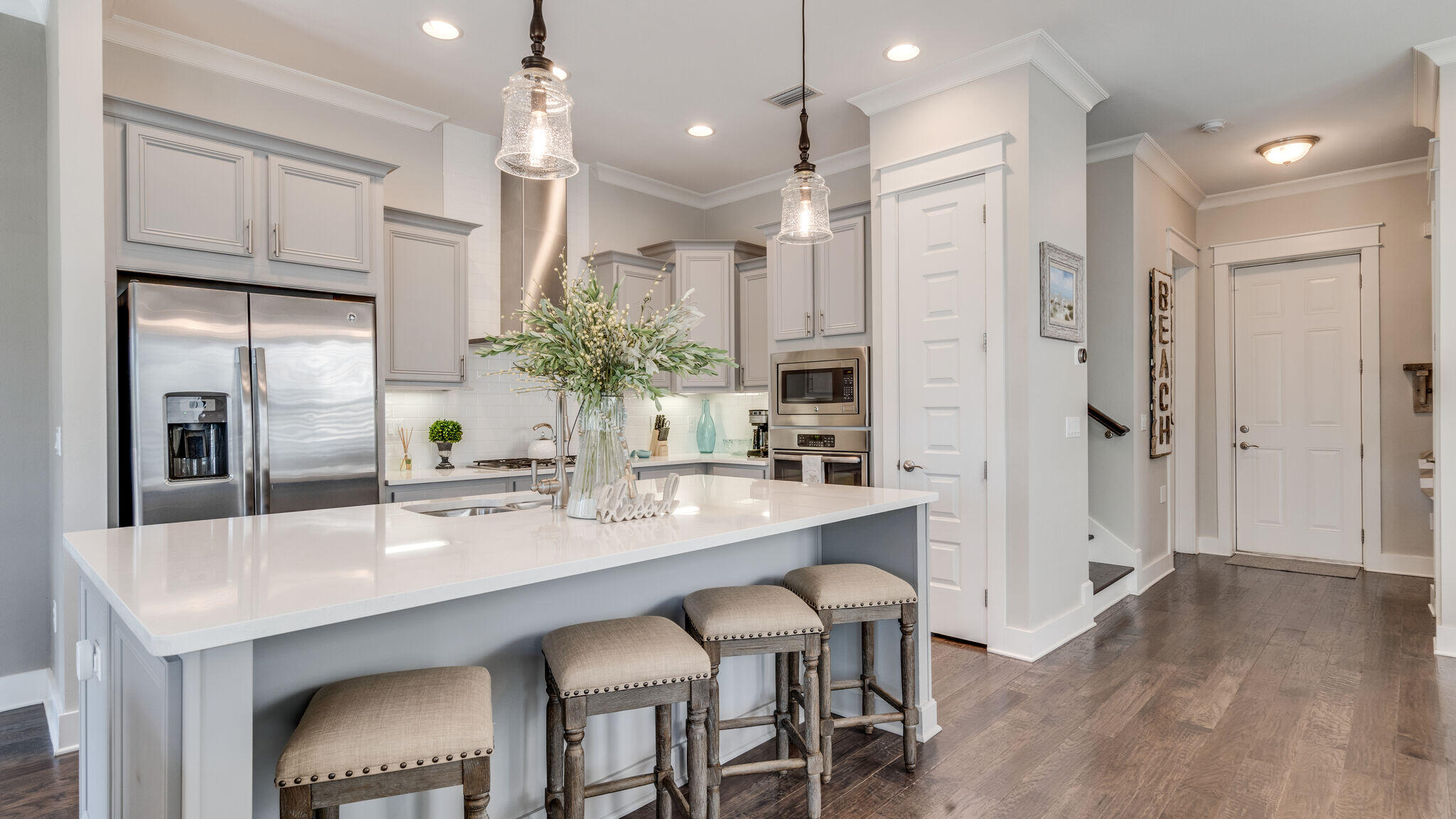 23 Milestone Dr Inlet Beach, Unit A Inlet Beach, FL 32461 - Photo 1 of 34 a large kitchen with a table and chairs