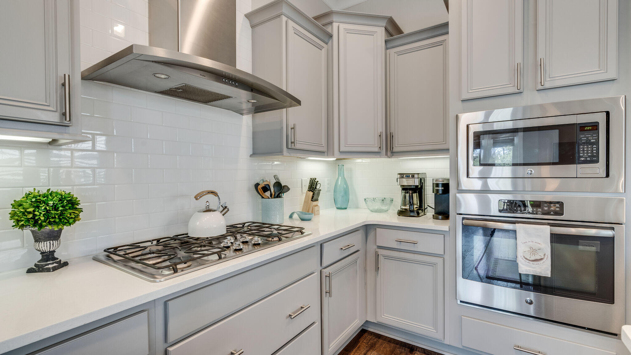 23 Milestone Dr Inlet Beach, Unit A Inlet Beach, FL 32461 - Photo 11 of 34 a kitchen with stainless steel appliances granite countertop a sink stove and cabinets