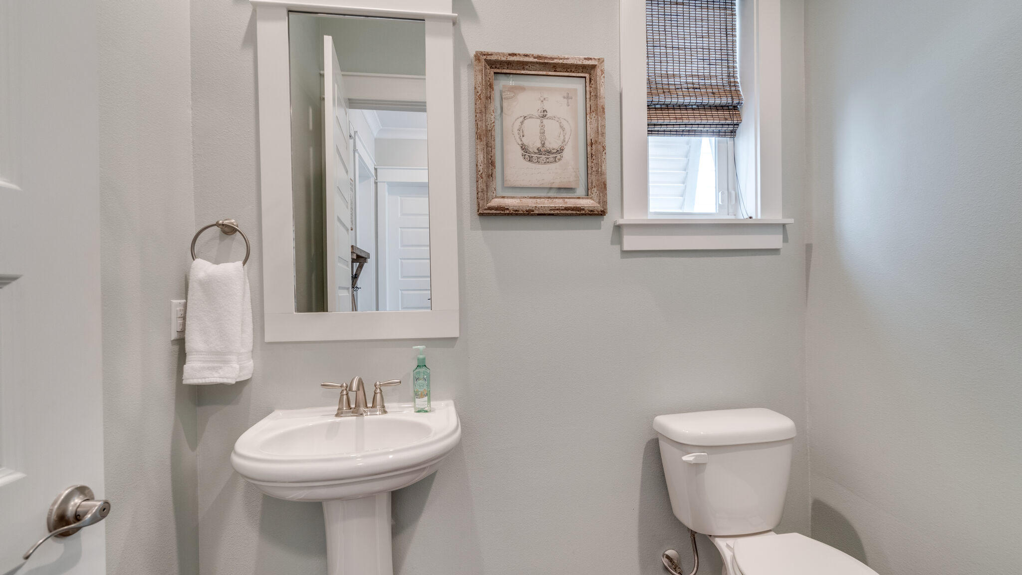 23 Milestone Dr Inlet Beach, Unit A Inlet Beach, FL 32461 - Photo 16 of 34 a bathroom with a toilet a sink and mirror