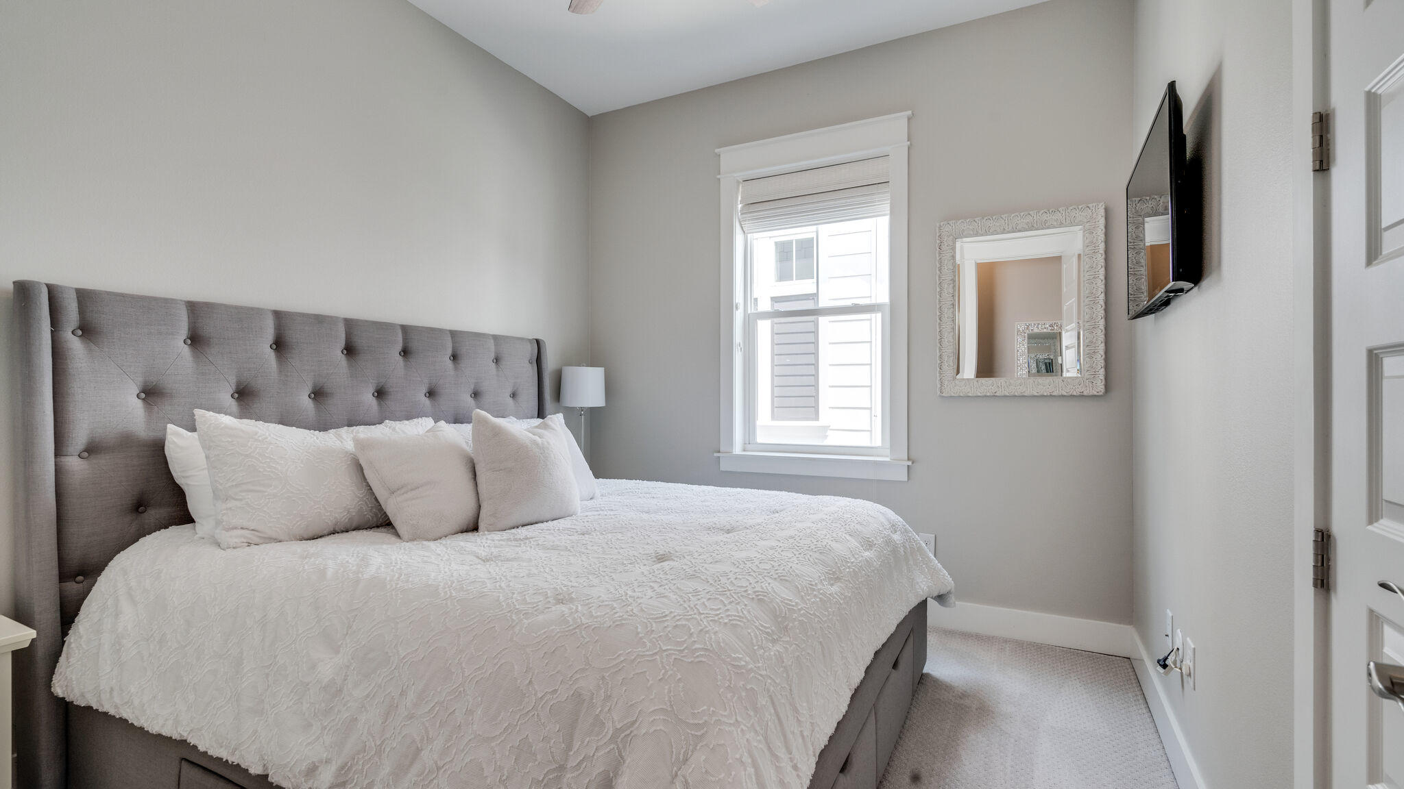 23 Milestone Dr Inlet Beach, Unit A Inlet Beach, FL 32461 - Photo 23 of 34 a bedroom with a large bed and a window