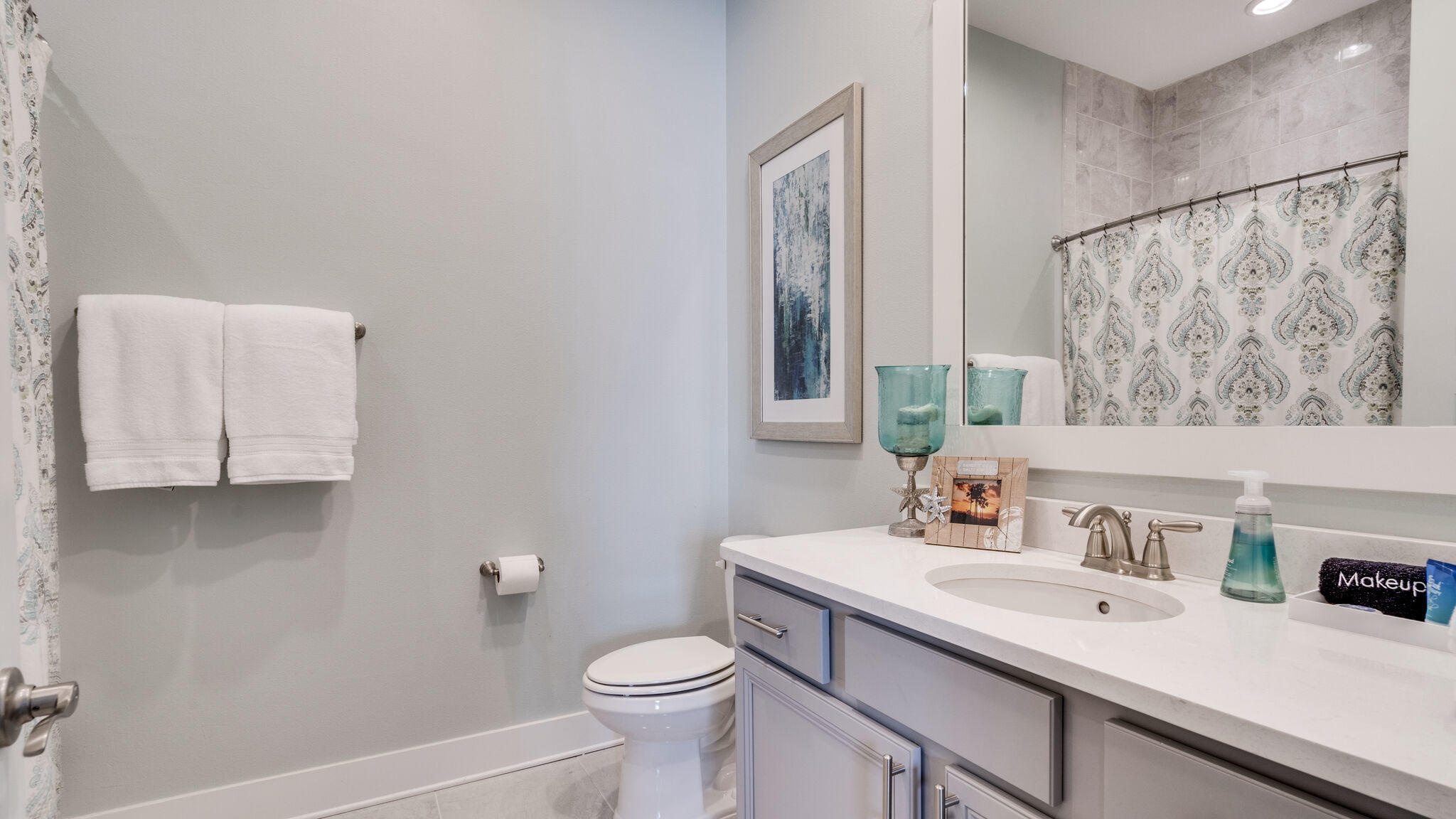 23 Milestone Dr Inlet Beach, Unit A Inlet Beach, FL 32461 - Photo 24 of 34 a bathroom with a sink vanity mirror and toilet