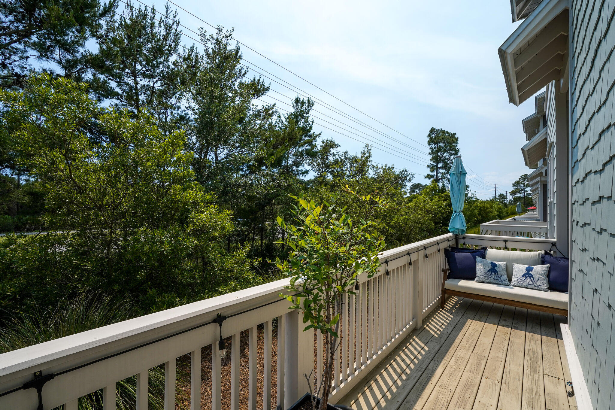 23 Milestone Dr Inlet Beach, Unit A Inlet Beach, FL 32461 - Photo 31 of 34 a view of balcony with wooden floor and fence