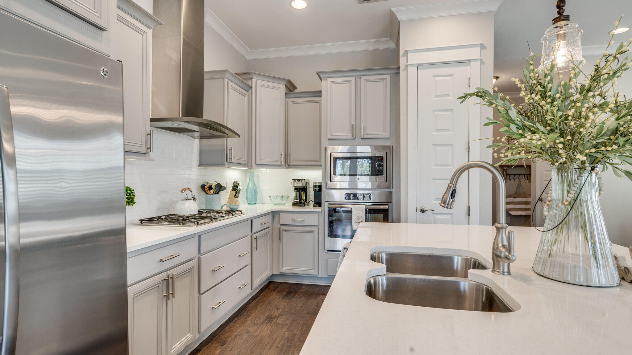 23 Milestone Dr Inlet Beach, Unit A Inlet Beach, FL 32461 - Photo 10 of 34 a kitchen with stainless steel appliances granite countertop a sink a stove and a refrigerator
