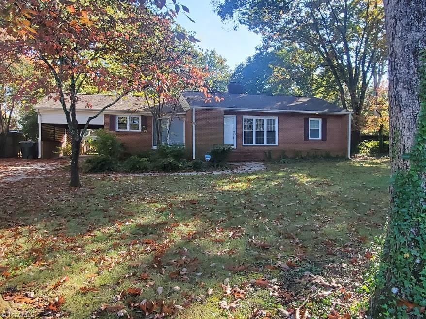 2207 Lane Road Greensboro, NC 27408 - Photo 2 of 19 Nice level lot with mature trees on a quiet street that is close to absolutely everything!