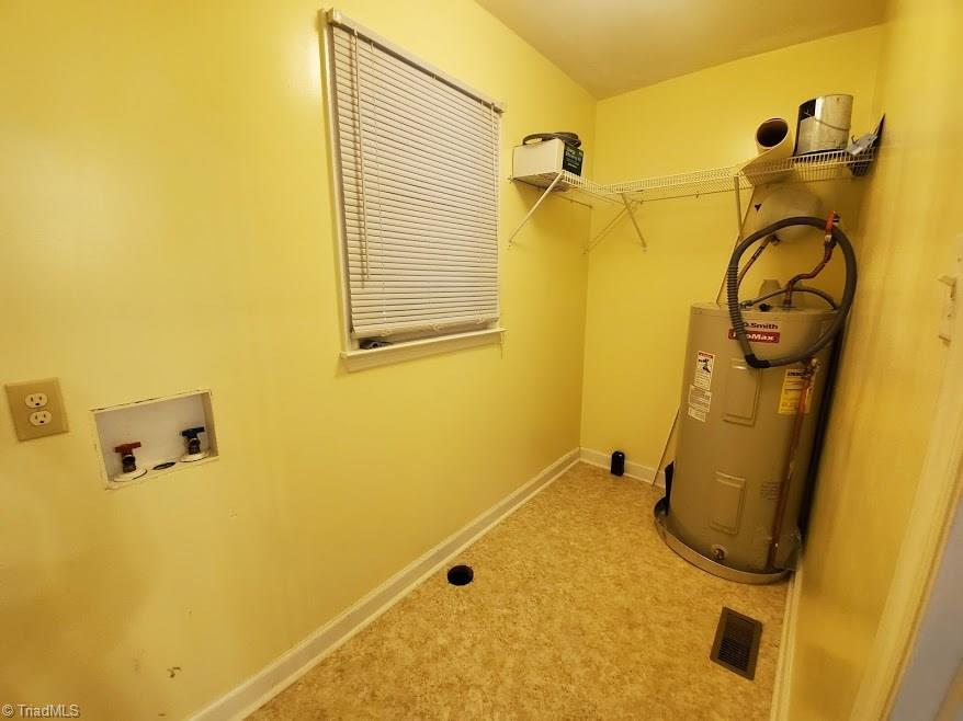 2207 Lane Road Greensboro, NC 27408 - Photo 9 of 19 I promise the laundry is NOT this yellow! The camera picked it up and ran with the color! Located just off the kitchen, it's convenient and roomy.