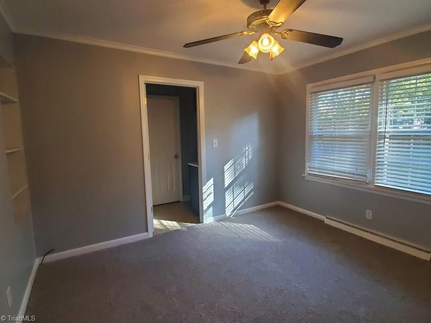 2207 Lane Road Greensboro, NC 27408 - Photo 10 of 19 The master bedroom is the only room in the house with carpet, which is brand new. There are built in shelves and a small walk in closet in the updated bath which is straight ahead in this picture.