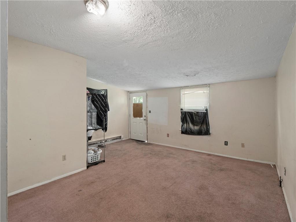 146 Monroe Street Rochester, PA 15074 - Photo 8 of 13 an empty room with chandelier