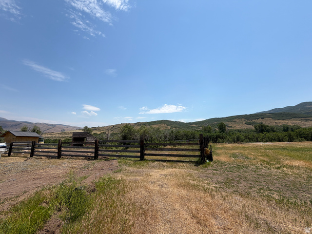785 Hardscrabble Road Morgan, UT 84050 - Photo 9 of 16 Expansive fenced area with a single-story structure and distant mountain scenery