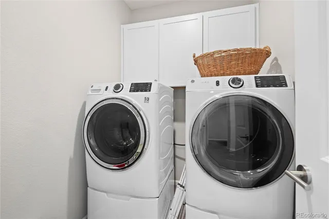a view of a house with swimming pool and sitting area