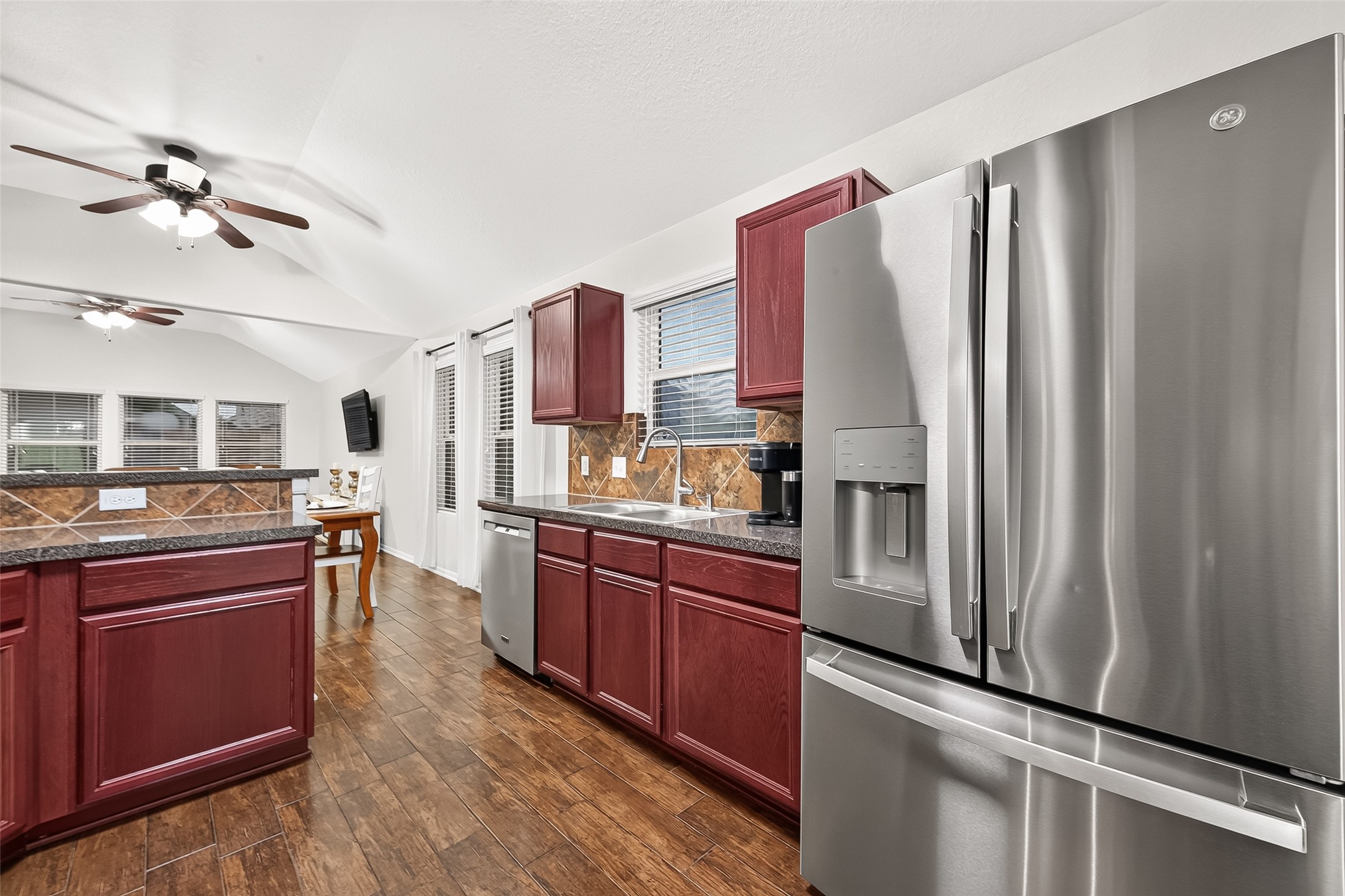 3155 View Valley Trail Katy, TX 77493 - Photo 27 of 50 right kitchen perspective highlighting the modern stainless refrigerator and extensive counter space