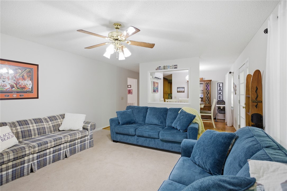110 Snug Harbor Road Seneca, SC 29678 - Photo 8 of 37 This bright living area features comfortable seating, ideal for relaxation and entertaining.