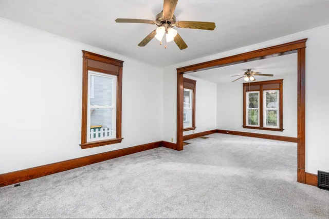 a view of an empty room with a window