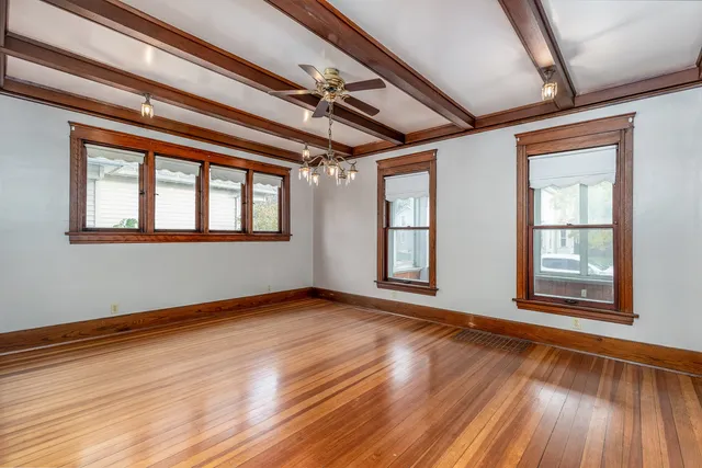 a kitchen with stainless steel appliances granite countertop wooden cabinets a sink and a stove