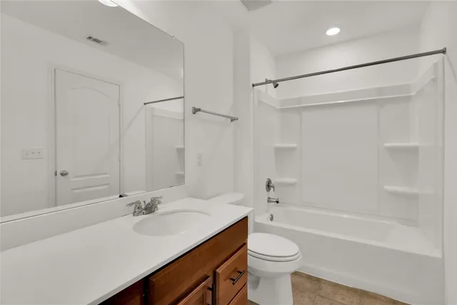 a bathroom with a sink a toilet and a bathtub